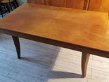 a wooden table that is sitting on the floor