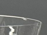 a clear glass with a black and white picture inside of it