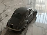 a toy car that is sitting on a marble table
