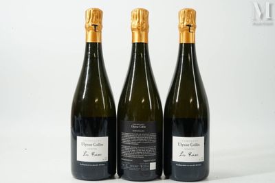 trois bouteilles de vin posées les unes à côté des autres sur une surface blanche