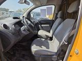 a yellow car with a gray seat and a black steering wheel