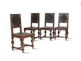 three wooden chairs with leather upholstered backs and a carved back