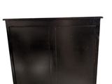 an image of a black cabinet with two doors