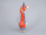 an image of a figurine of a giraffe on a gray background