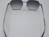 a close up of a pair of sunglasses on a white surface