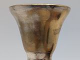 an image of a silver vase sitting on top of a black base