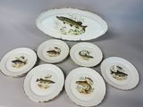 six plates with fish on them sitting on a table