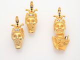 three gold - plated figurines of a woman and a man