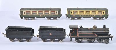 several toy trains are lined up in a row on a white surface