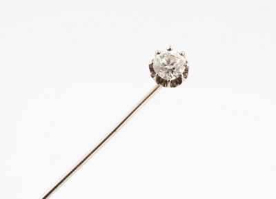 a close up of a diamond on a stick on a white background