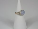 a close up of a white cone with a ring on it