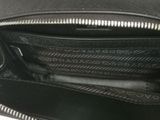 the inside of a black purse with a zipper on it