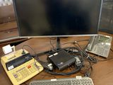 an image of a computer desk with a keyboard and a monitor