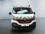 the front of a white van with a red and white stripe on it