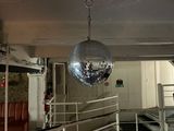 a disco ball hanging from the ceiling in a room