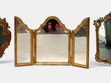 three mirrors that are sitting next to each other