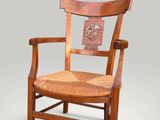 an image of a wooden chair with a carved back and seat