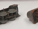 several pieces of metal are sitting on top of a white table
