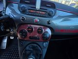 a dashboard of a car with a red and black dash board