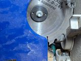 someone is using a circular saw to cut a piece of wood