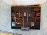 an overhead view of a tool box with tools in it
