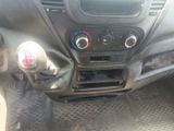 a car dashboard with a clock and other items in it