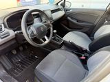 the interior of a small car with a steering wheel and dashboard