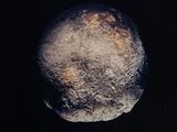 a close up of an object in the dark sky with a black background