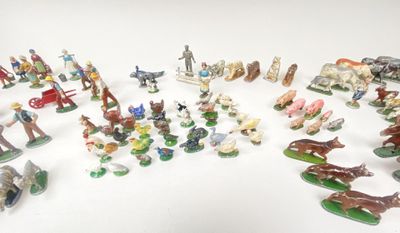 many figurines of different types and sizes on the table