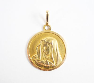 a close up of a gold medal with a woman and child in it