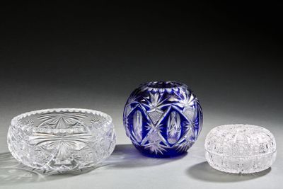 three glass bowls and a bowl sitting on a table