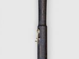 a very old looking pipe that is on the wall