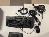 a keyboard, mouse, and other electronics on a table
