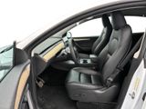the interior of a white car with black leather seats and a steering wheel