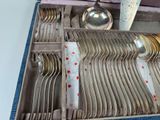a box with a bunch of silverware in it