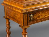 a small wooden table with a clock on top of it