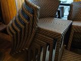several wicker chairs and tables in a room with wood flooring