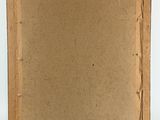 an empty canvas on a wooden easel on a white surface