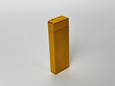 yellow lighter on a white surface with a white background