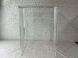 a glass picture frame on a table with a white background