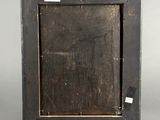 an old wooden picture frame with a tag on it
