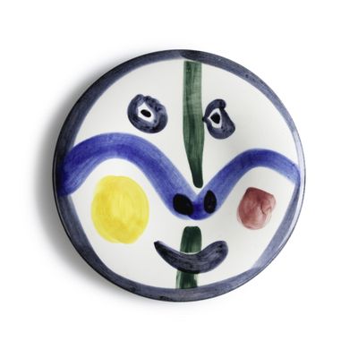 a picture of a plate with a face painted on it