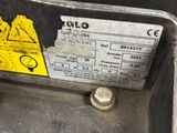 a close up of a metal sink with a yellow sticker on it