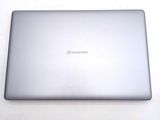 a silver laptop sitting on a white surface