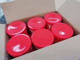 a box full of red plastic cups sitting on a table