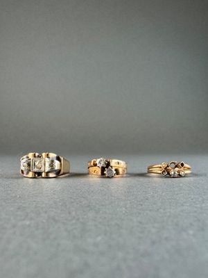 three different types of rings on a table with a gray background