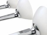 three spoons that are sitting next to each other on a white surface