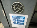 a close up of a parking meter with a sign on it