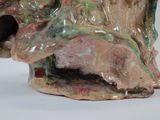 a close up of a ceramic sculpture of a dog