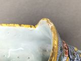 a vase that has been decorated with flowers on it